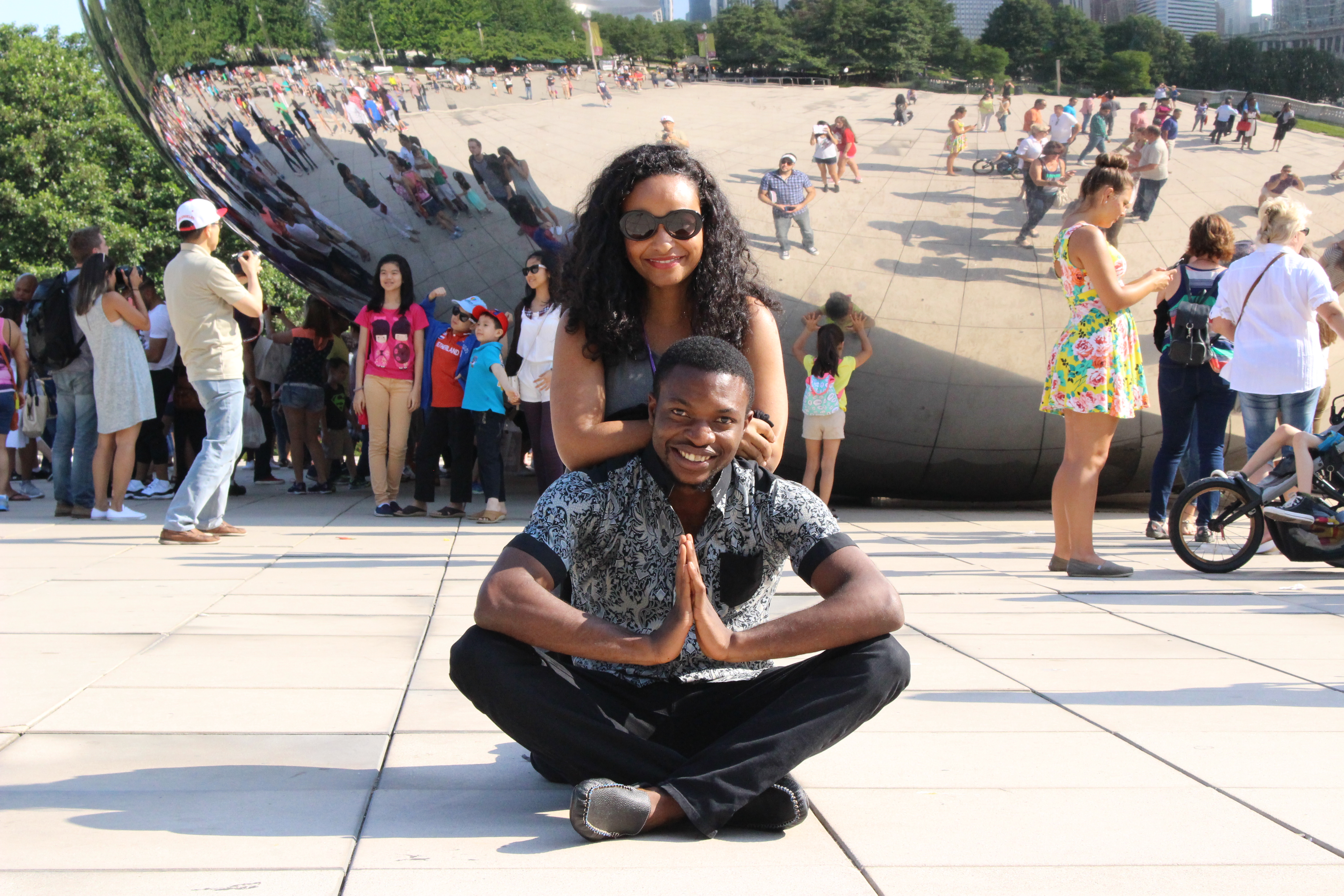 Fellows posing in front of the bean in chicago