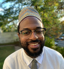 Rasul Miller headshot. He is smiling